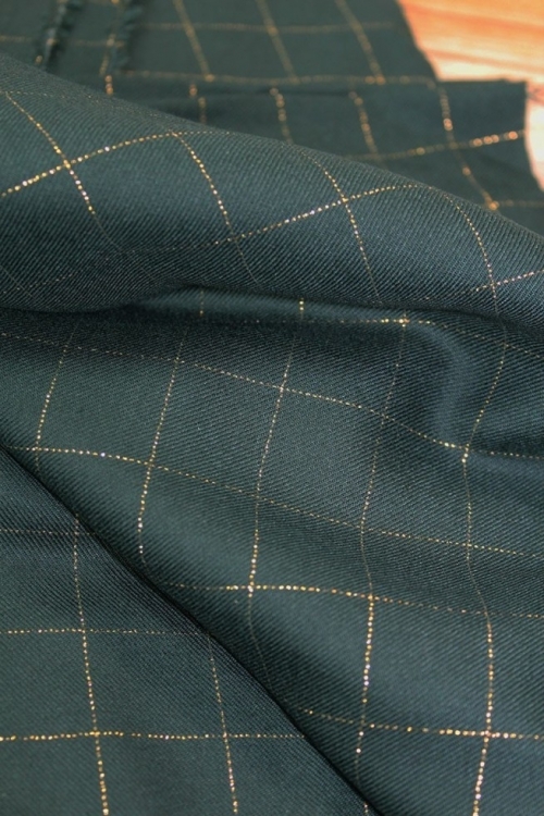 Eglantine and Zoe Lurex Viscose Twill Fabric Dark Green & Gold